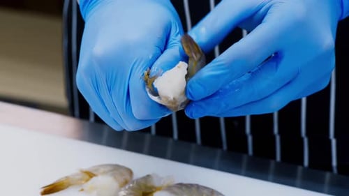 Preparing Raw Shrimp on a Cutting Board
