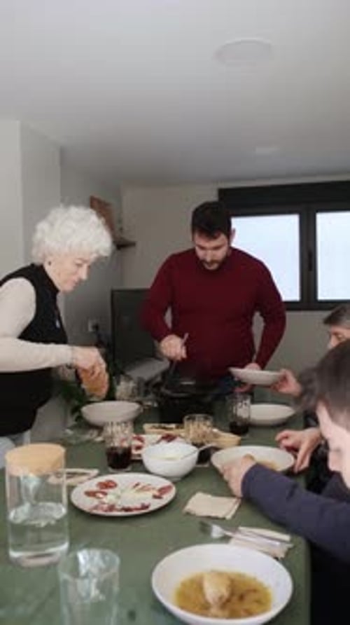 Family and Friends Enjoying Meal Together Indoors