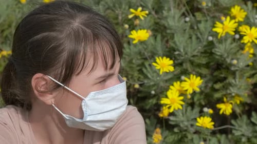 During Spring Flowering in a Protective Mask
