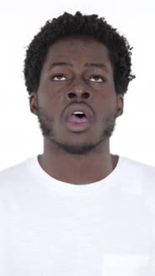 Man Showing Intense Frustration and Anger on White Background