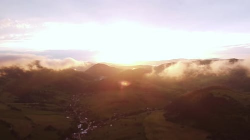 Aerial View of Sunset in Rural Hilly Landscape