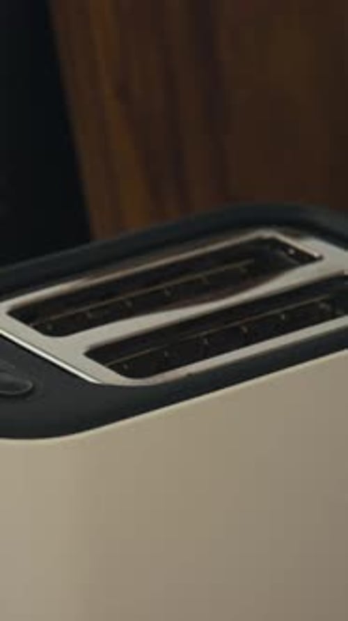 Placing Toast into a Toaster Appliance