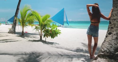 Woman Relax on Beach Under Coconut Palm Tree