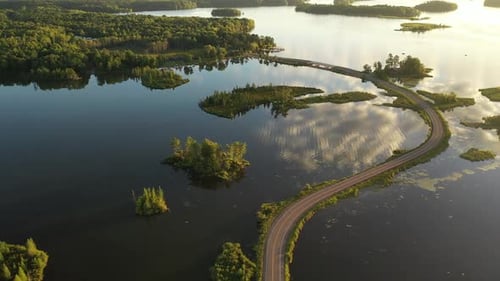 Beautiful Aerial View of Winding Road Through Peaceful Lake Islands