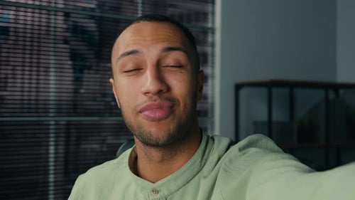 Cheerful Young Man Chatting Via Video Call