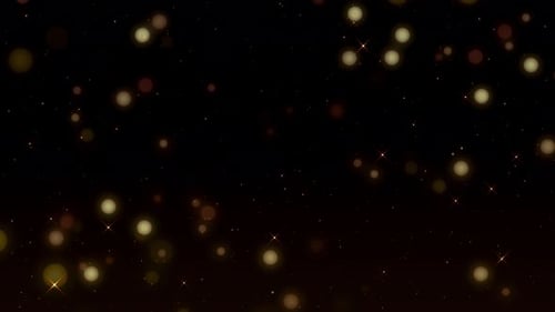 Goldstaubpartikel mit leichtem Spezialeffekt und Bokeh.