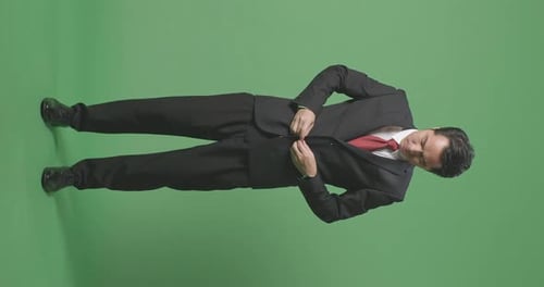 Asian Business Man Wearing Suit On Green Screen Background