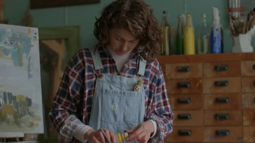 Artist Preparing Colors For Painting Female Painter Creating Artworks in Workshop