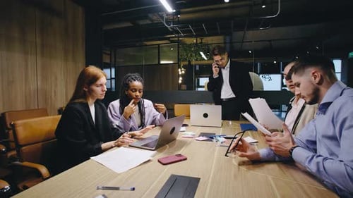 In a Modern Office a Diverse Team Collaborates in a Professional Meeting to Brainstorm Innovative