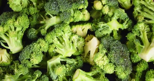 Rotating fresh broccoli close up .