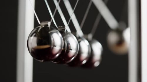 Newton Balls Closeup Five Metallic Pendulums on Black Background Cradle