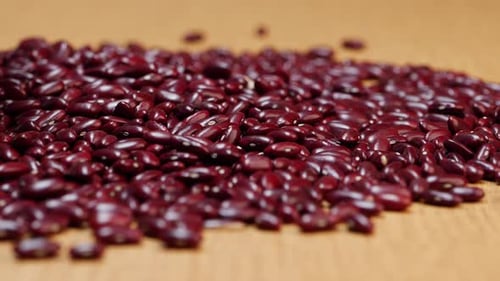 Pile of Shiny Kidney Beans Shifting on Table