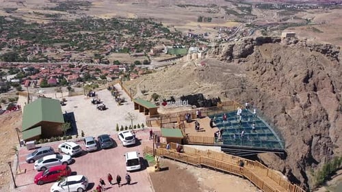 Aerial View Of People Enjoying The View On The Glass Terrace On The Hill