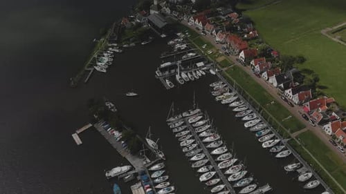 Aerial view of marine port area for pleasure boats and sailboats with typical houses of the Dutch vi