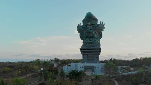 Aerial view of grand statue at GWK park during sunset, Indonesia.