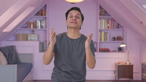 Indian man laughing on someone