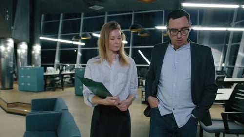 Business Colleagues Walking and Talking in Modern Office