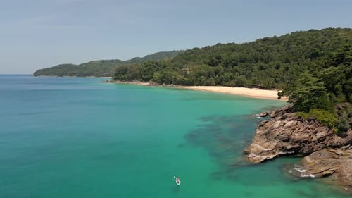 Tropical Beach with White Sand and Tourist on Paddle Board on Turquoise Water