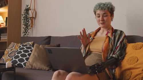 Woman with Prosthetic Arm on Video Call