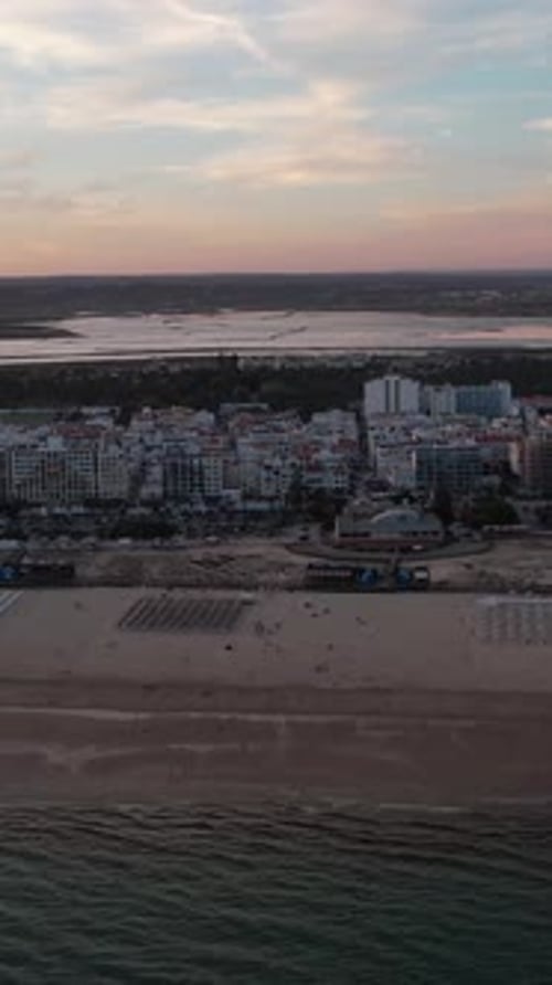 Vertical Video of sunset on the beach in Monte Gordo. Algarve, Portugal