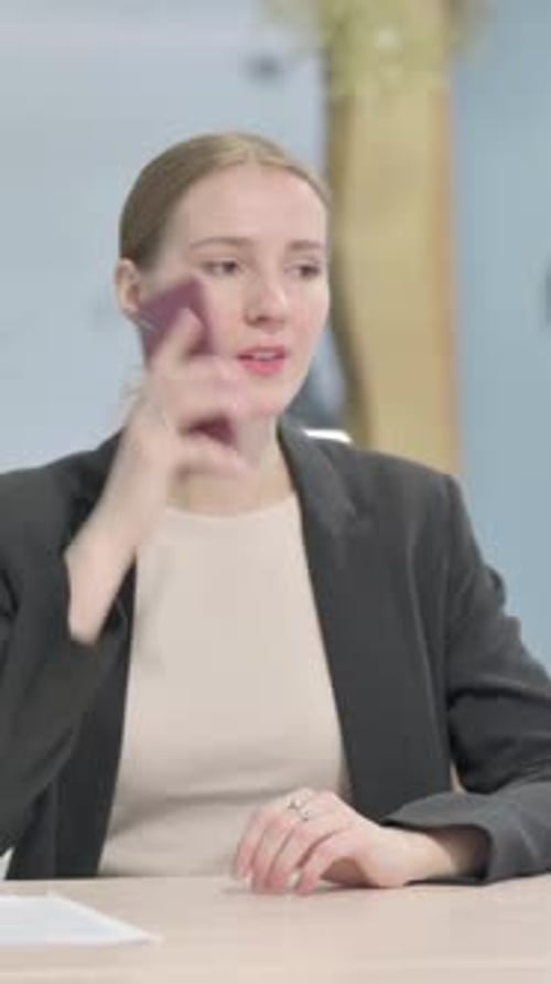 Businesswoman Talking on Phone in Office, Vertical Video