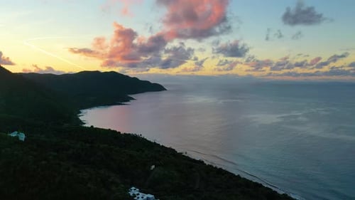 Warm Amber Skies Over St. Croix Island Point and Tranquil Ocean Waters