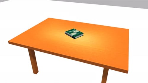 Physics textbook resting on an orange wooden table