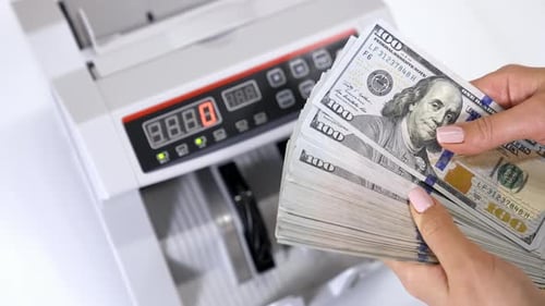 Bundle of one hundred dollar banknotes.