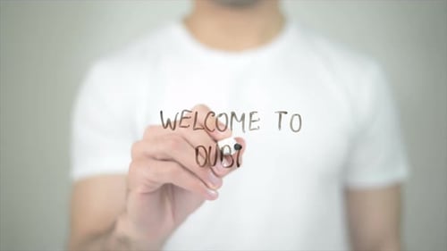 Welcome to Dubai, Man Writing on Transparent Screen