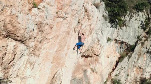 Rock climber climbing the rock 10