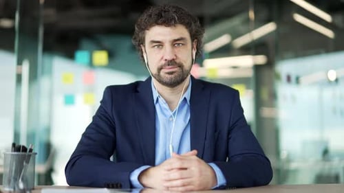 Webcam view. Businessman watching video call online conference looking at camera at laptop computer