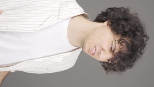 Vertical video of Angry and frustrated young man.