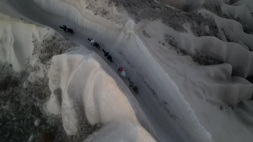 Tourists Horseback Riding In Cappadocia At Göreme National Park In Turkey. Aerial Drone