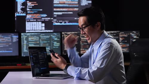 Ecstatic Coder Working at Night in an Office