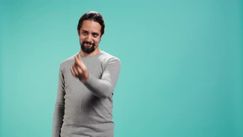 Happy Man Asking for Money with Hand Gesture Rubbing Fingers Together
