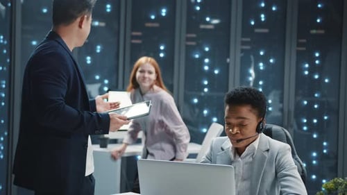 Colleagues Collaborating in Modern Office Environment