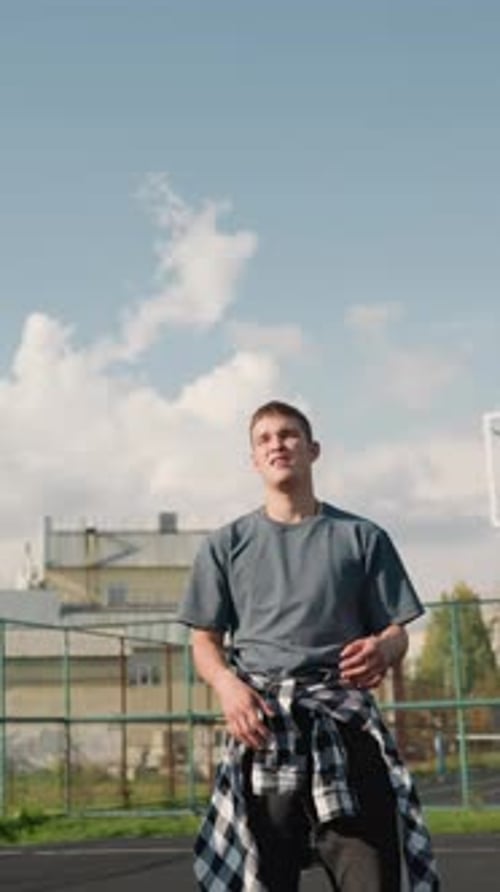 Friends playing volleyball outside on school sports court