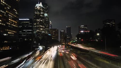Downtown Los Angeles busy highway traffic, cityscape night time lapse