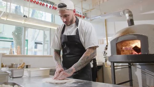 Chef Prepares Pizza Dough in Restaurant Kitchen