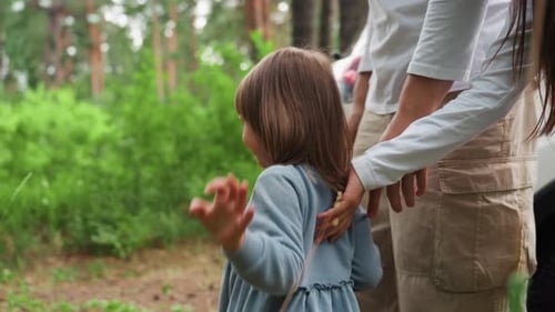 Playful Kids Walk Joyfully Into Forest As Youngest Leads Way