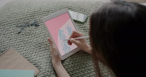 Artist Drawing Digital Illustration on Tablet at Home