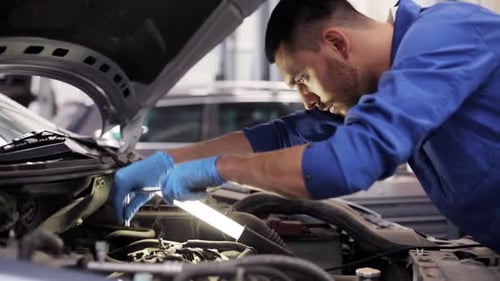 Car Service, Repair, Maintenance and People Concept - Mechanic Man with Wrench