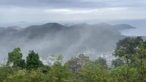 Misty Mountains and Tropical Island Overlook