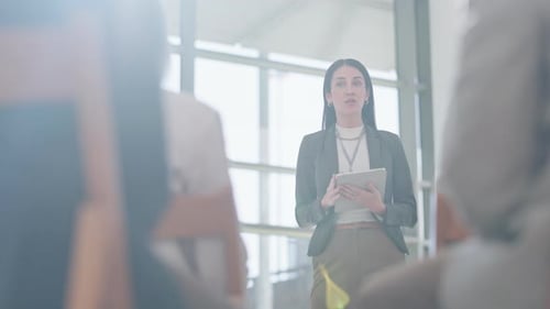 Presentation, tradeshow and woman with tablet talking to audience for conference