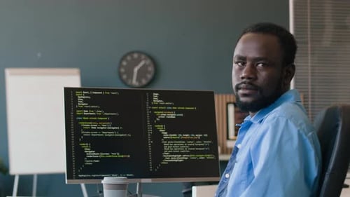 Young Black Programmer At Work In Office
