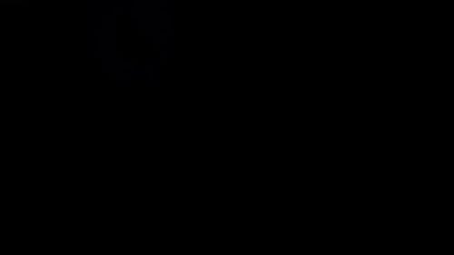 Dynamic neon light trails flow through dark abstract space