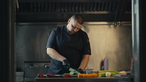 Chef Preparing Fresh Vegetables in Restaurant Kitchen