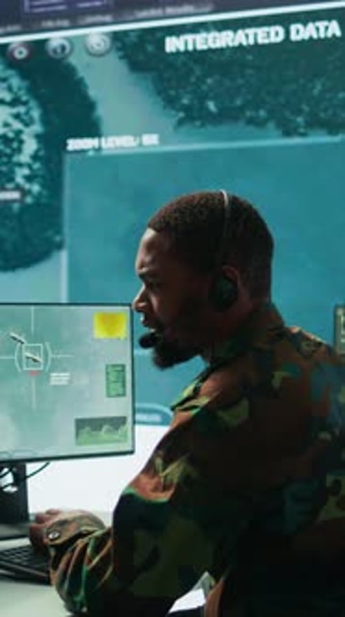 Vertical Video Soldiers in State of the Art Military Control Room Collaborate on Data Analysis