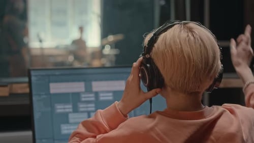 Female Producer Recording Music Band in Studio