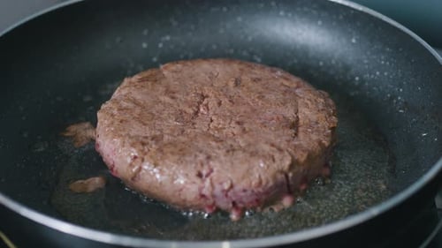 Ground Beef Burger Cooking in Frying Pan